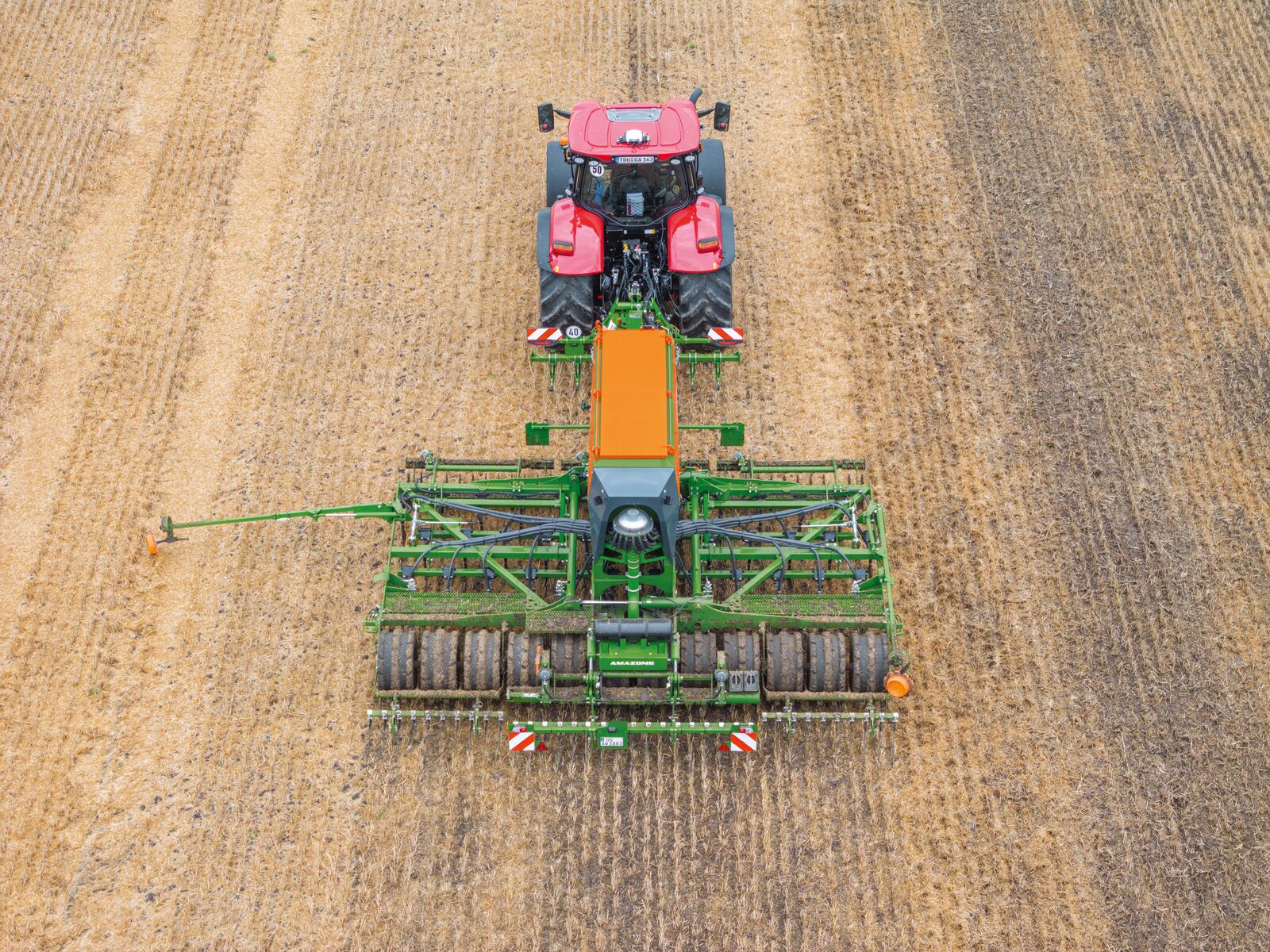 The Cayena 6001-C working in stubble, with the rear Matrix tyre packer reconsolidating only the seed rows after placement